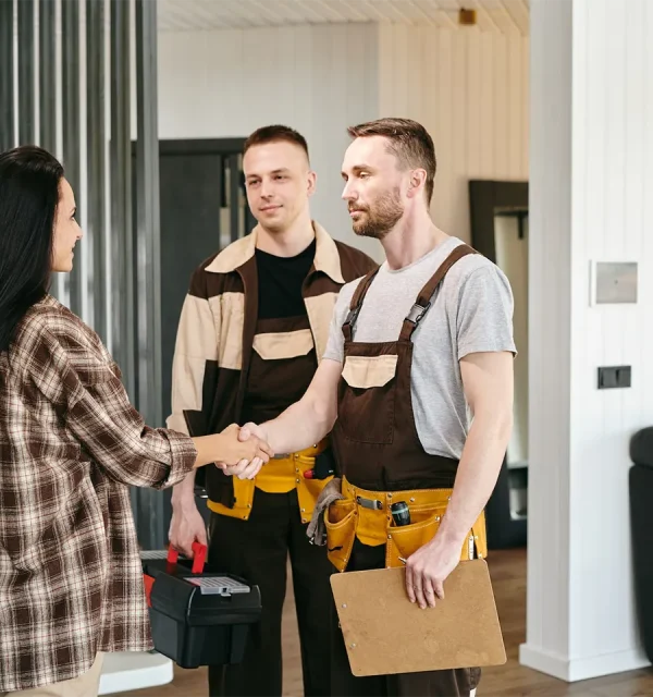 a-group-of-people-discussing-plumbing-troubles-in-living-room